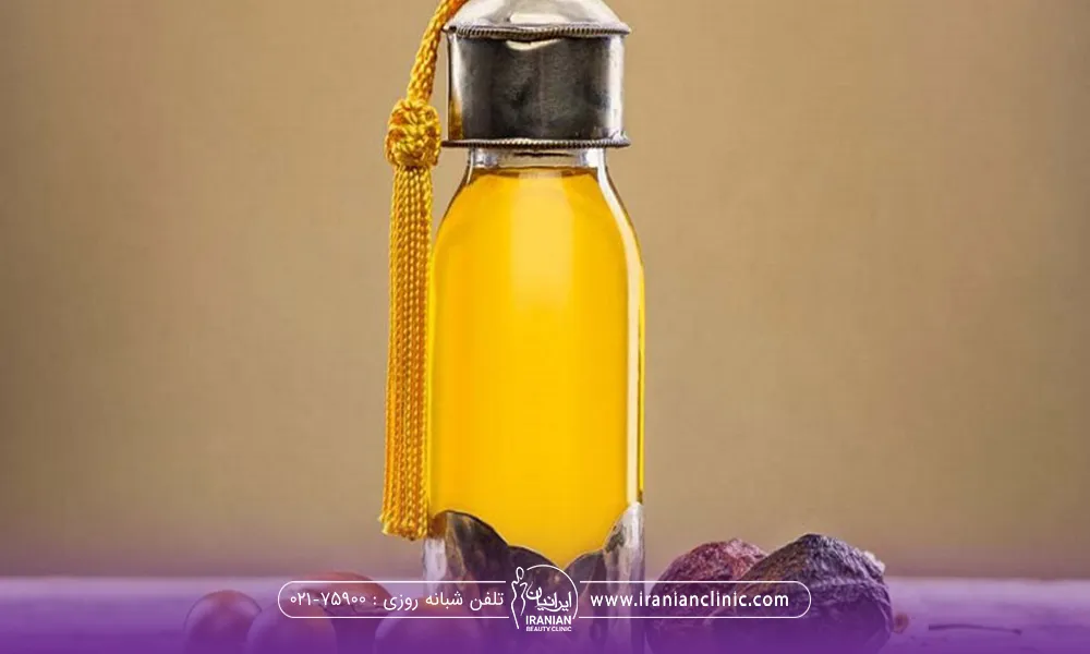 یک شیشه کوچک روغن زرد رنگ - روغن های مفید برای ریزش مو